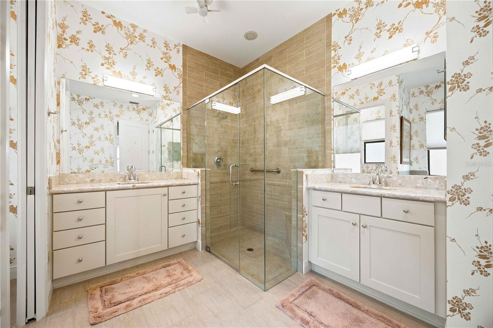The primary ensuite has dual vanities, a large walk in shower, a soaking tub and private water closet. - 23709 WAVERLY CIR, VENICE