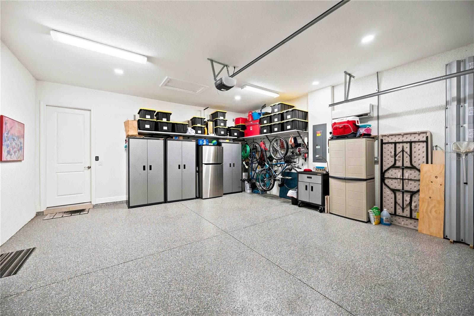 Organization galore in the garage.  Epoxy coated floor. - 23709 WAVERLY CIR, VENICE