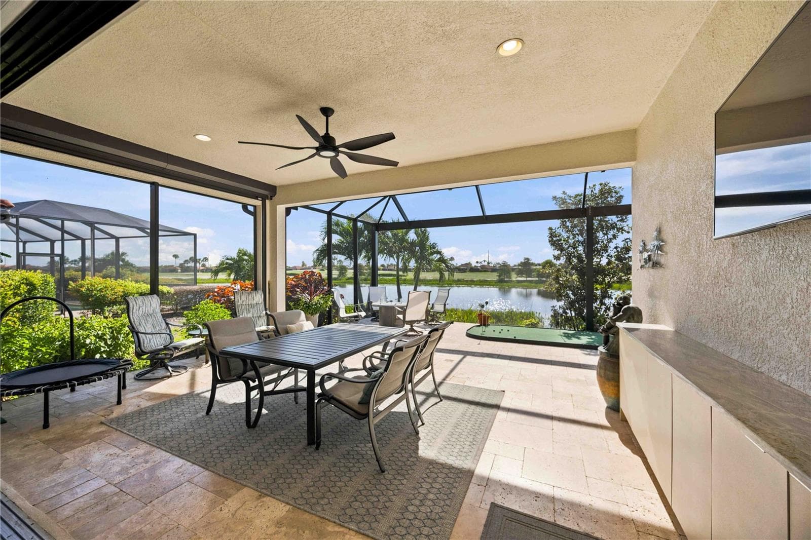 Extended lanai extends outdoor living - protected by two storm smart screens. - 23709 WAVERLY CIR, VENICE