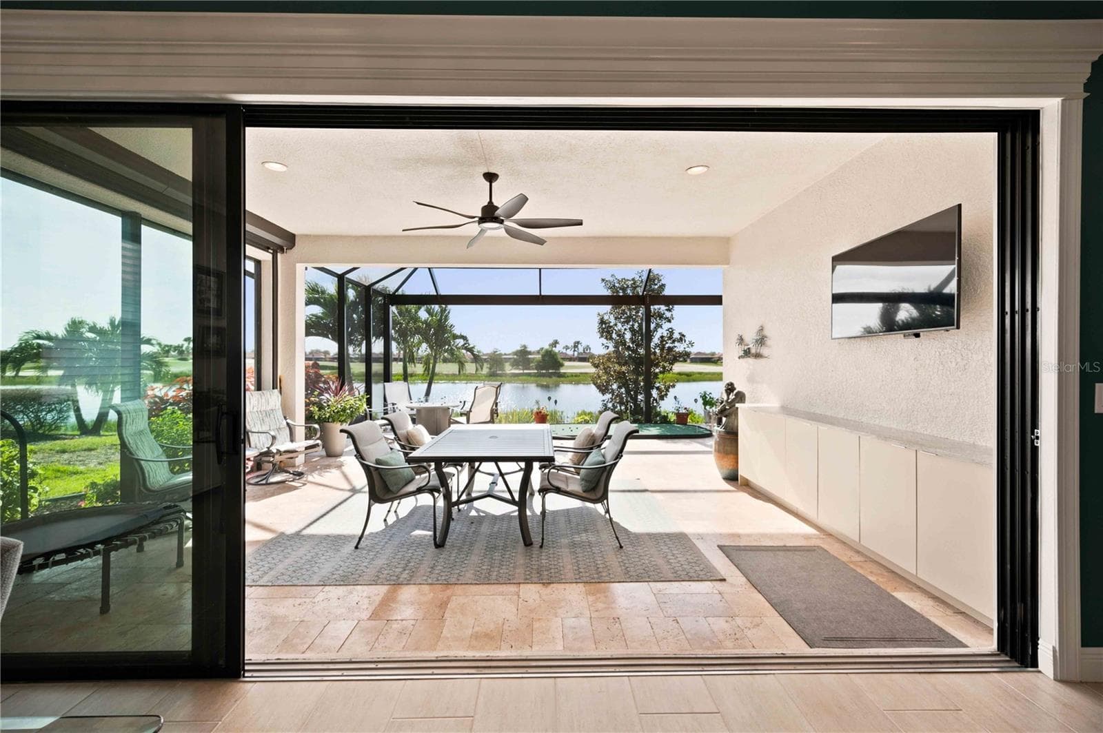 The travertine lanai is stunning.  A fabulous spot to relax - 23709 WAVERLY CIR, VENICE