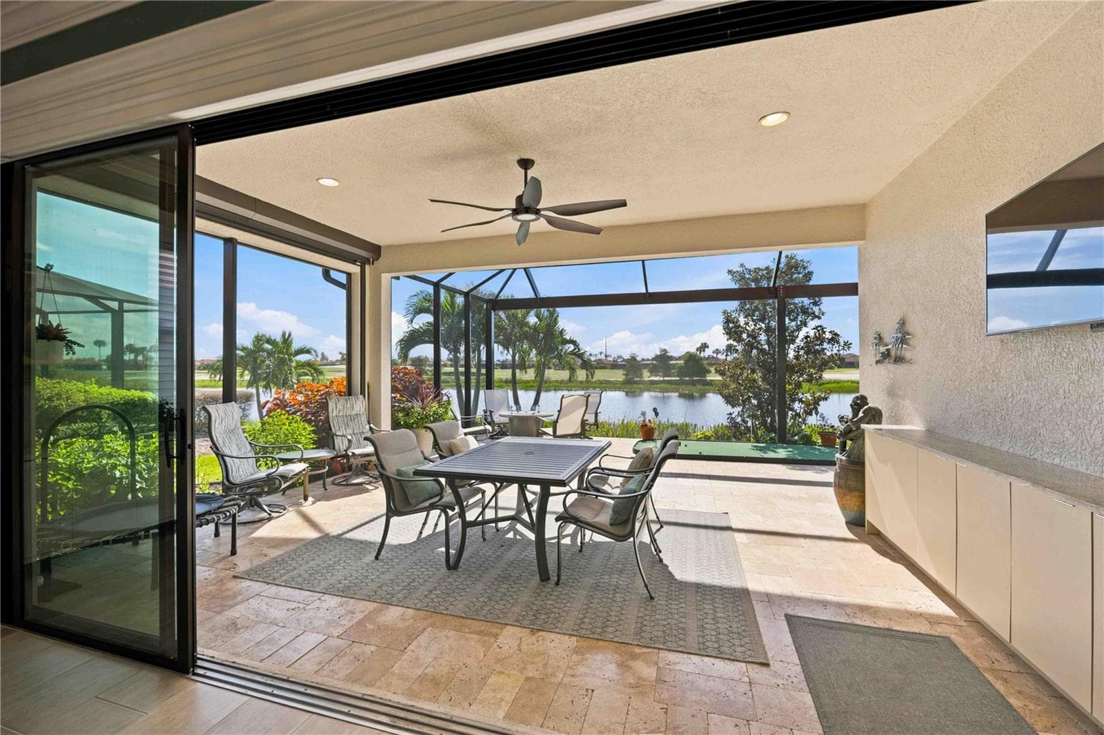 The travertine lanai is stunning.  A fabulous spot to relax - 23709 WAVERLY CIR, VENICE
