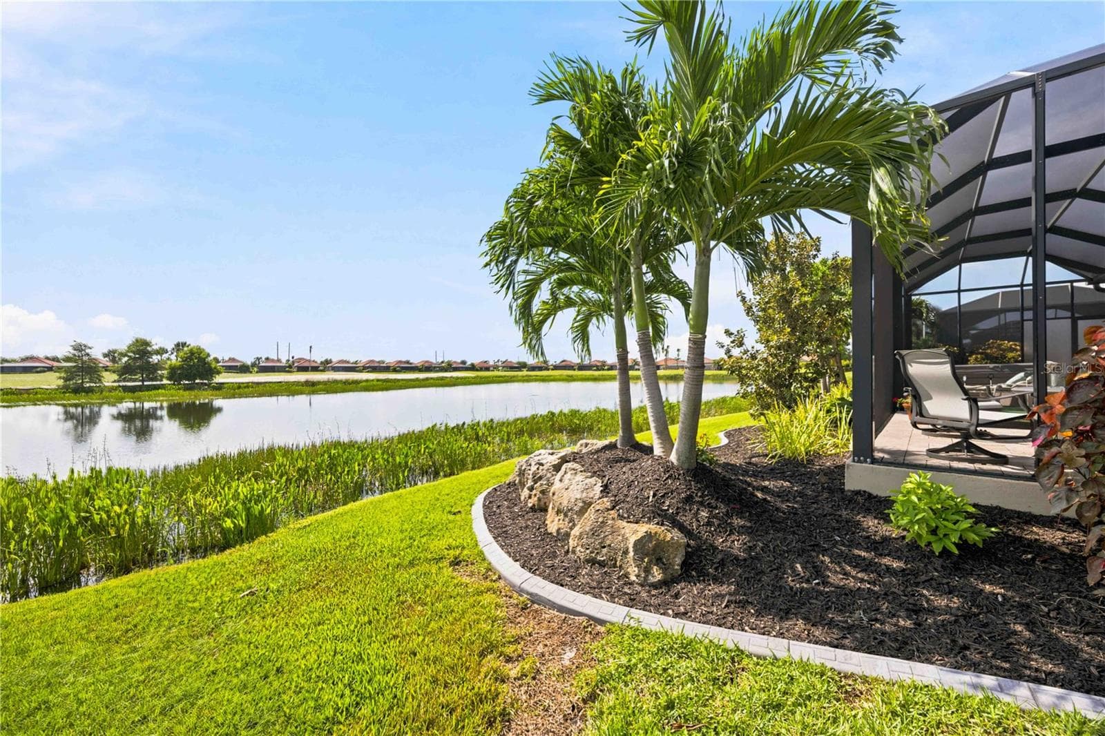 The back yard landscaping is just as beautiful as the front - - 23709 WAVERLY CIR, VENICE