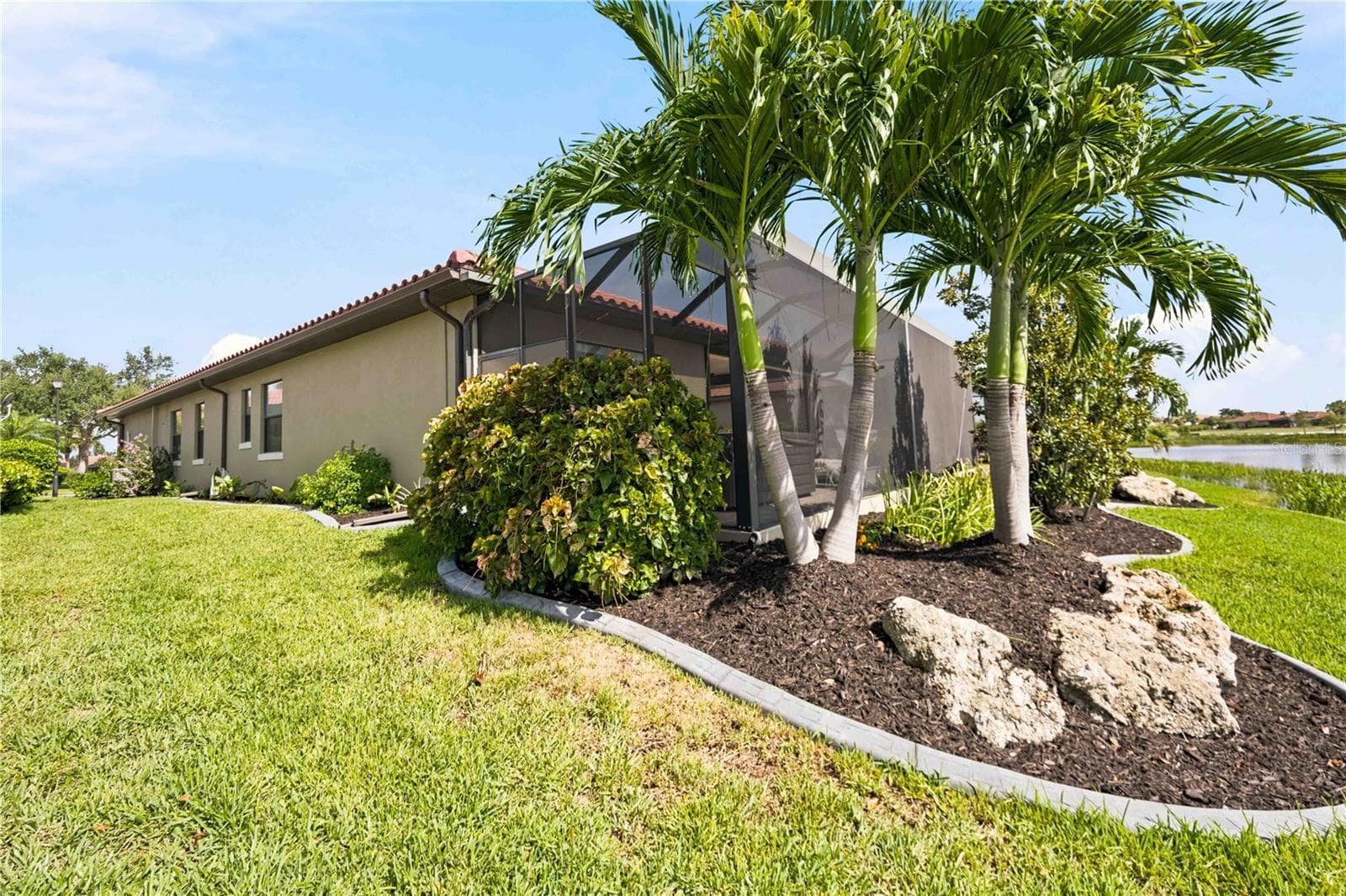 The back yard landscaping is just as beautiful as the front - - 23709 WAVERLY CIR, VENICE