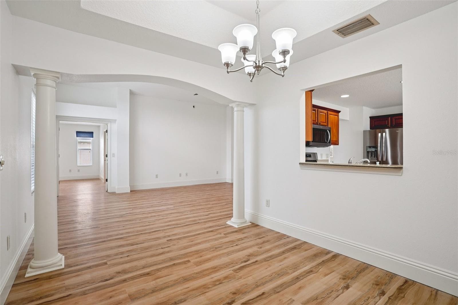 Dining Room into Living Room - 1722 BUGLE TER, THE VILLAGES
