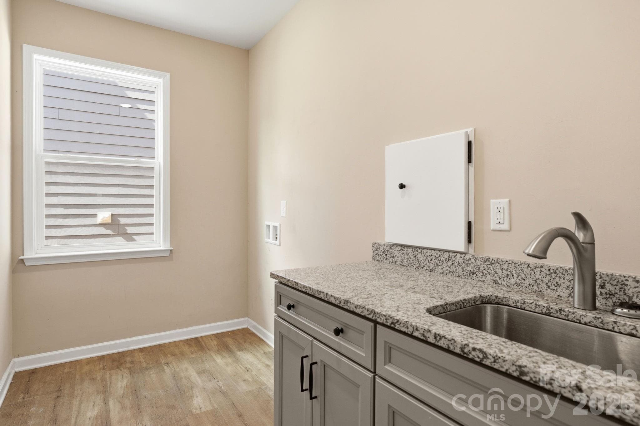 Main Level Laundry Room with Laundry Chute to the Primary Bedroom Closet - 1134 Baldwin Drive, Lancaster