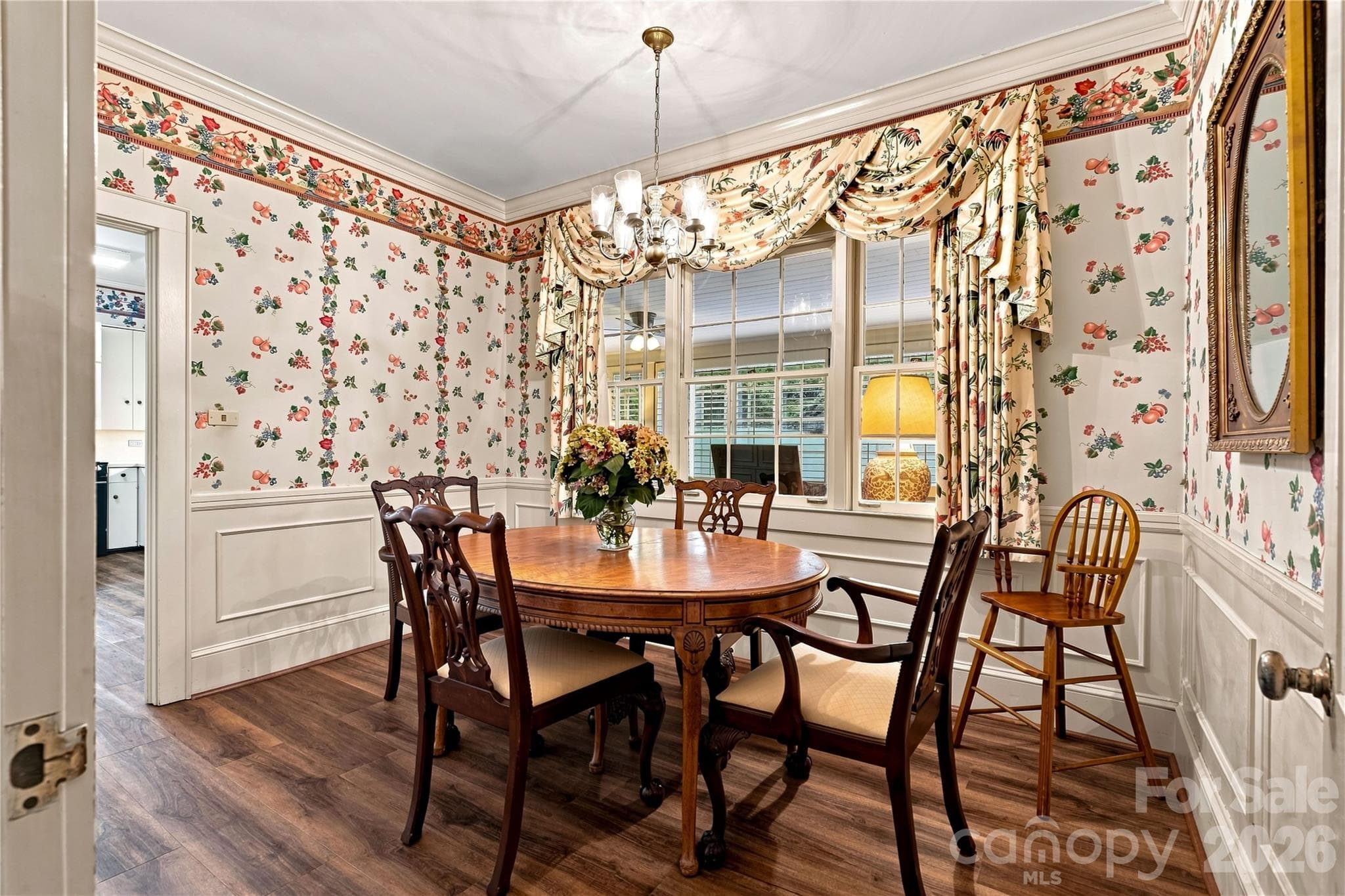 Breakfast room with built-in cabinetry and backyard views. - 209 Labans Lane, Lincolnton