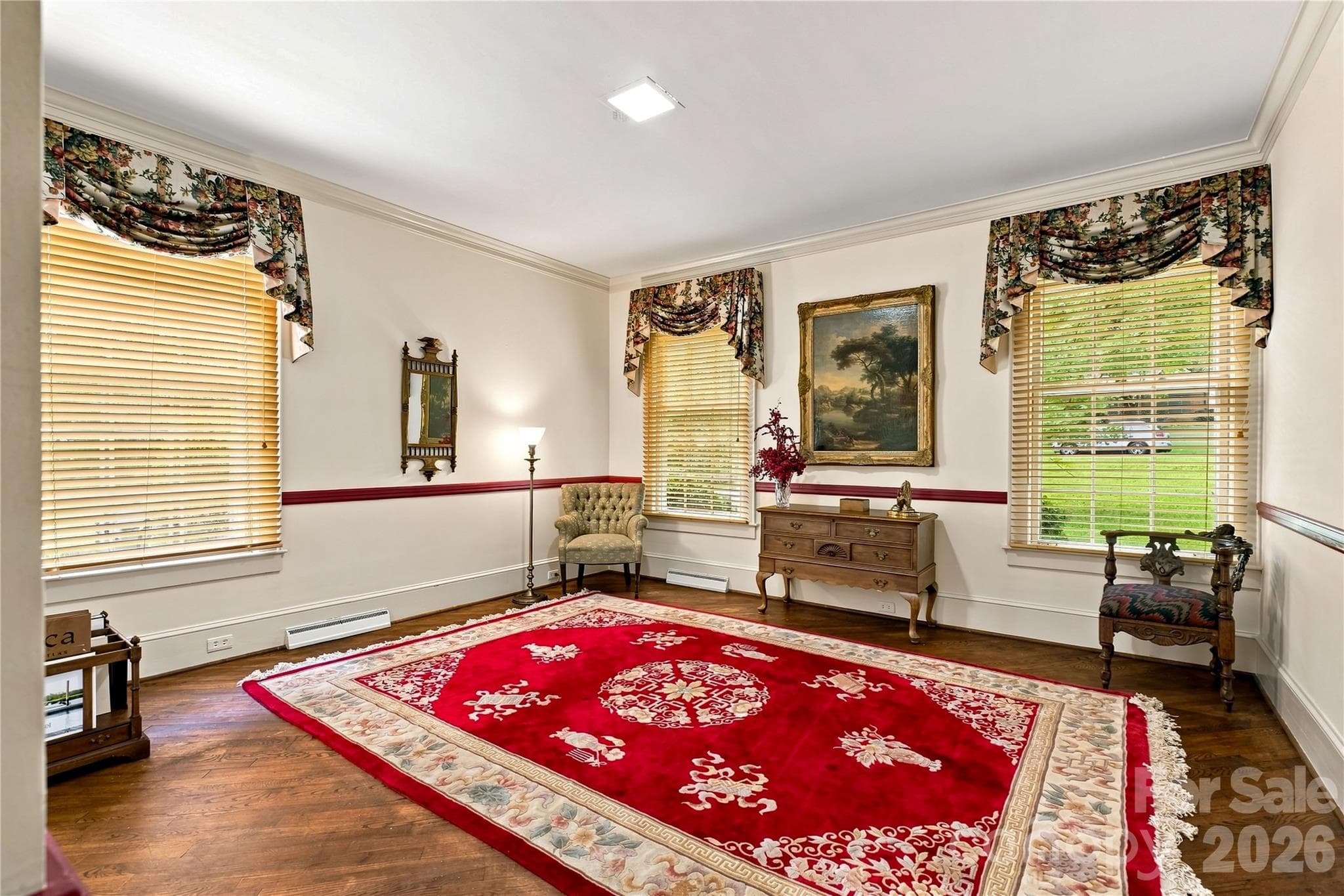 Main-level bedroom with natural light and an ensuite bath. - 209 Labans Lane, Lincolnton