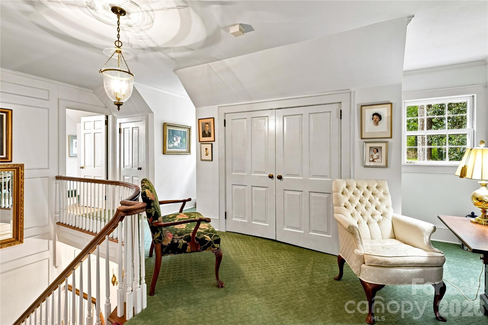Upper-level landing with built-in storage and architectural details. - 209 Labans Lane, Lincolnton