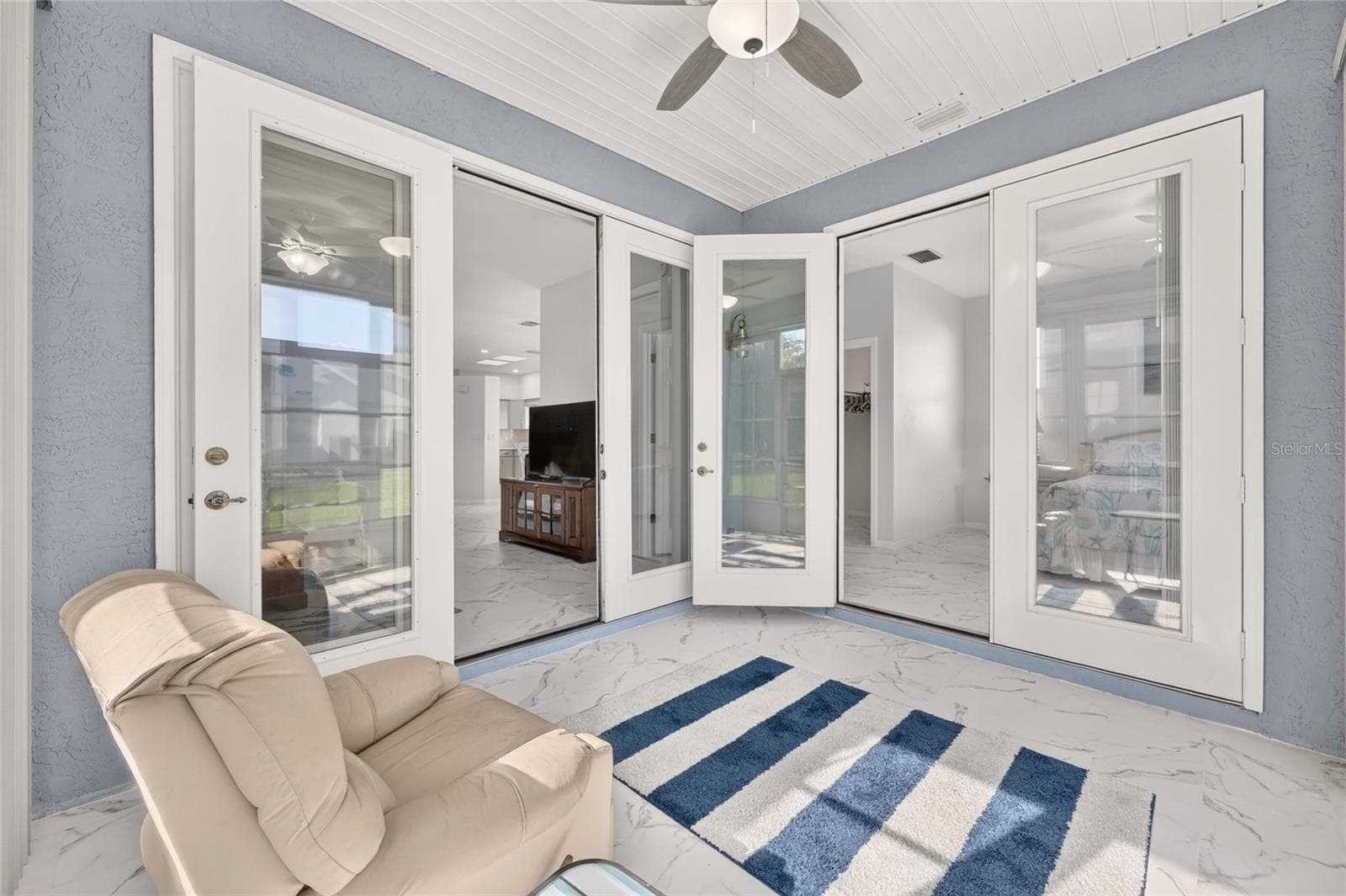 FRENCH DOORS INTO LIVING ROOM AND PRIMARY SUITE - 3556 S BELGRAVE DR, INVERNESS