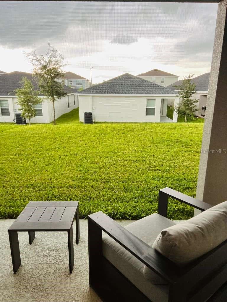 Back Yard Patio view - 2223 ORCHID DR, DAVENPORT