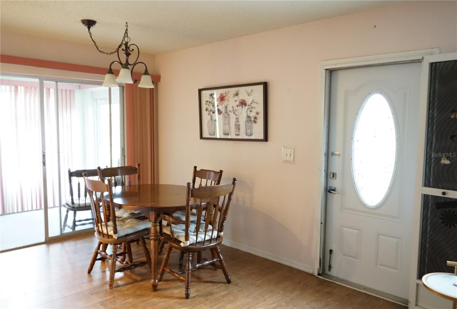 dining area with slider out to lanai - 1904 CANTERBURY LN #24, SUN CITY CENTER