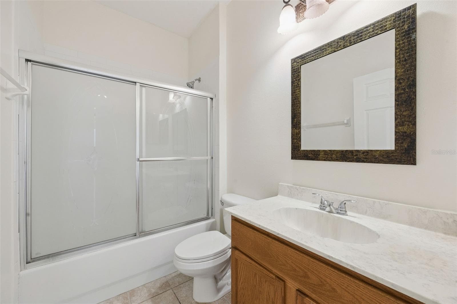 Downstairs Bathroom at end of Hallway - 14720 SWEET ACACIA DR, ORLANDO