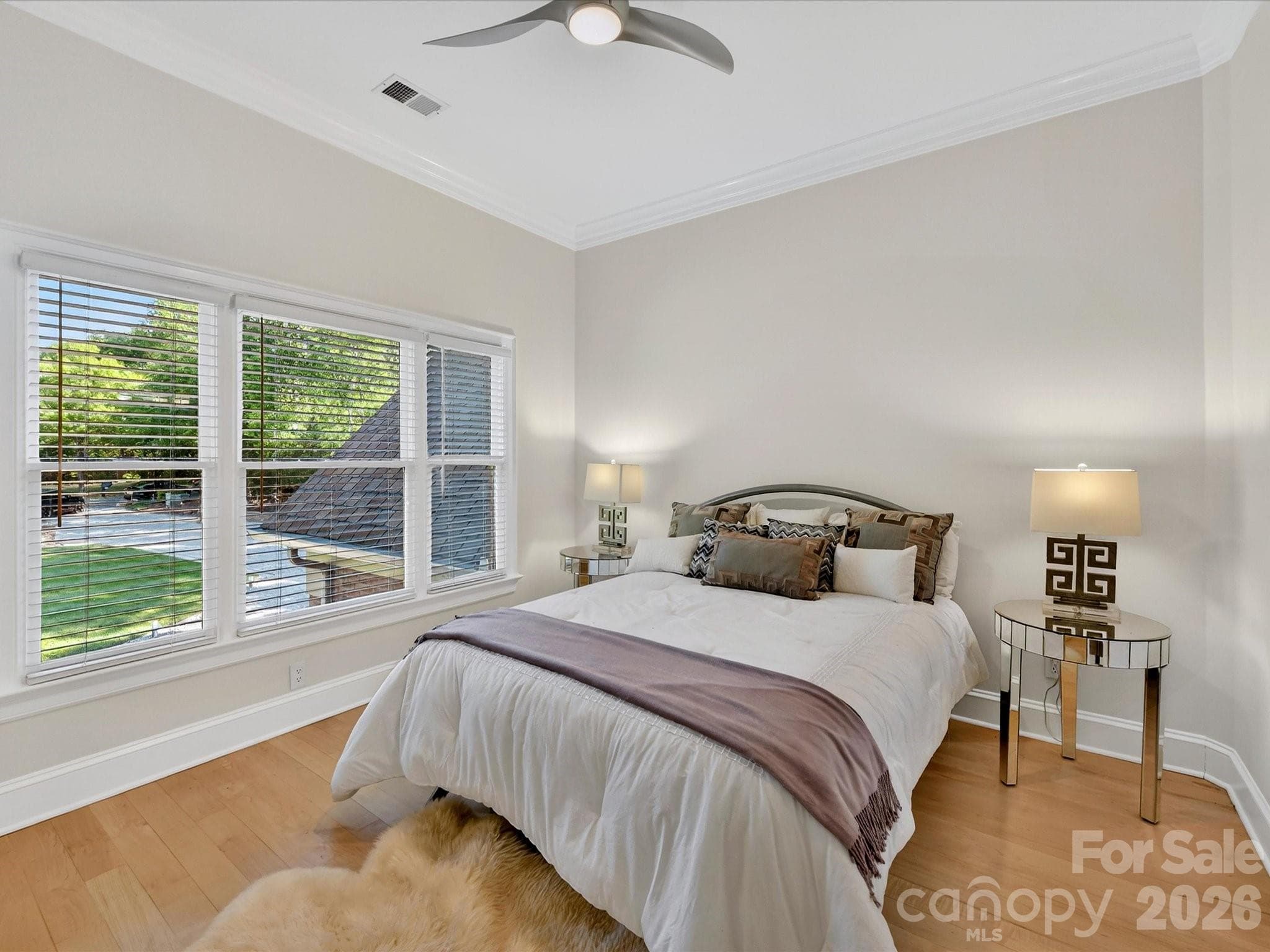 Bedroom three with natural light and Jack and Jill-style bath arrangement. - 2723 Providence Pine Lane, Charlotte