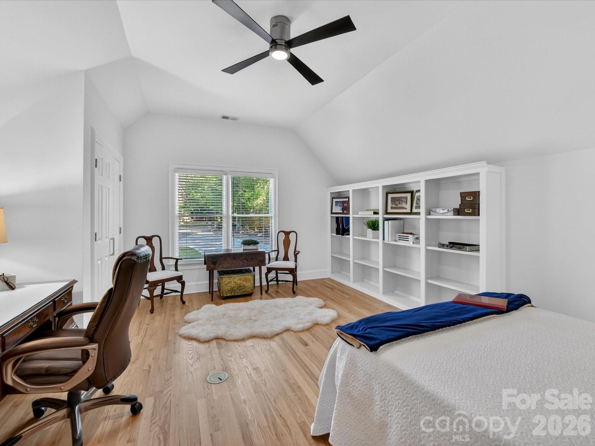 Bedroom four is a large bonus/bedroom with built-ins, a desk and dual deep closets. - 2723 Providence Pine Lane, Charlotte