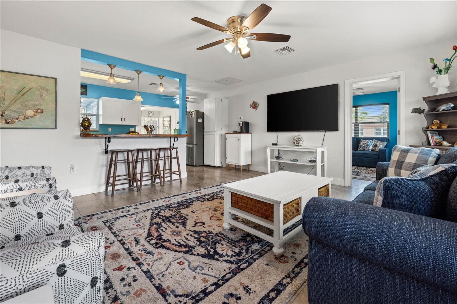 You can see how the floorplan opens into the kitchen, and also the third bedroom/family room. - 7035 DUKE ST, ENGLEWOOD