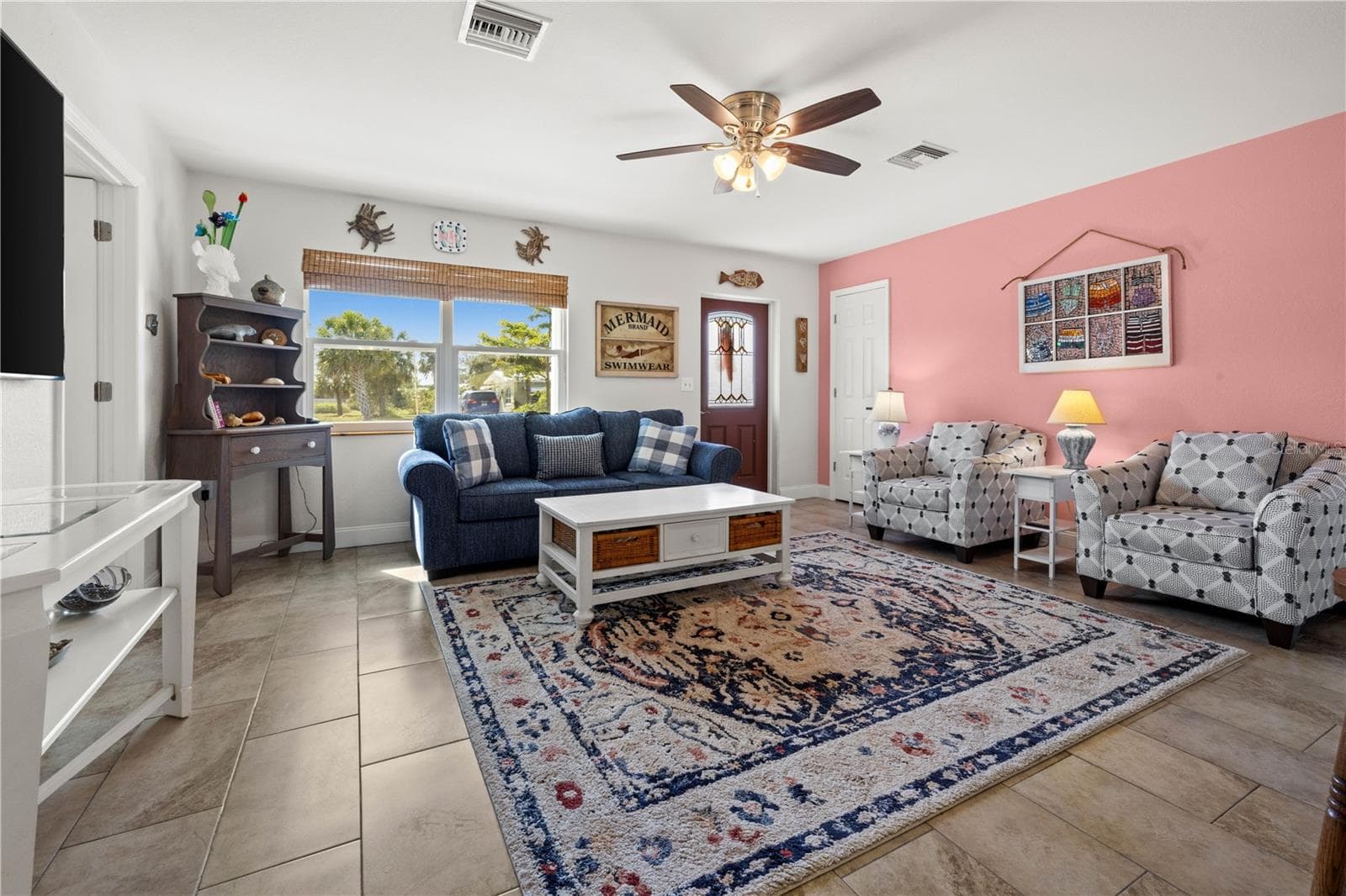Throughout the home are well maintained ceramic tile.  The living room is bright and spacious. - 7035 DUKE ST, ENGLEWOOD