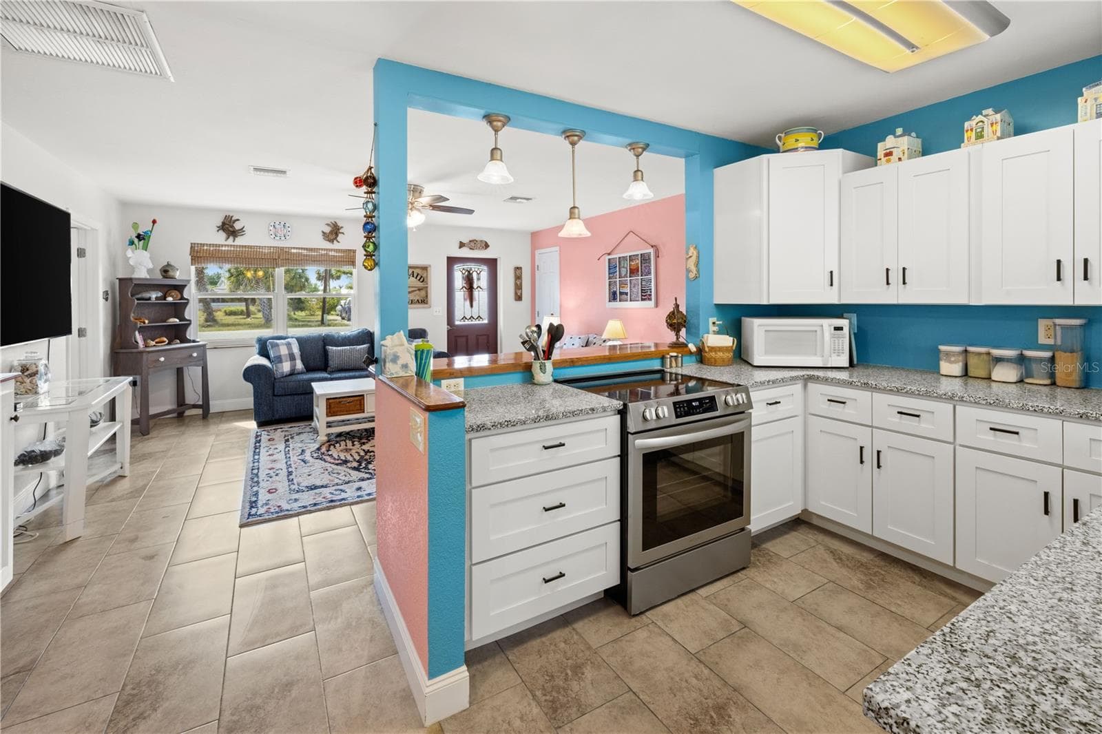 It's a "cook's kitchen".  Well designed and organized with stone counters and updated cabinetry. - 7035 DUKE ST, ENGLEWOOD