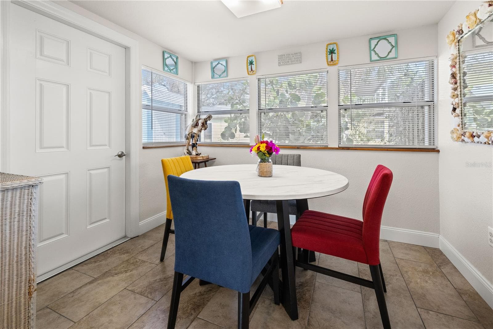 The dining area also opens into the back yard.  It's a peaceful view into the back yard. - 7035 DUKE ST, ENGLEWOOD