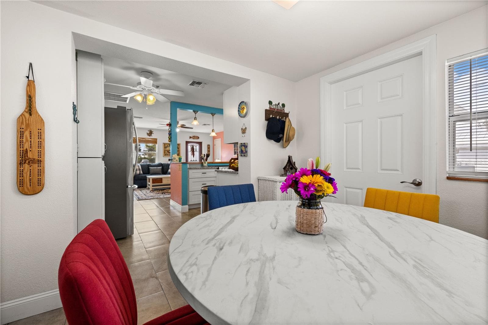 A view into the kitchen from the dining area. - 7035 DUKE ST, ENGLEWOOD