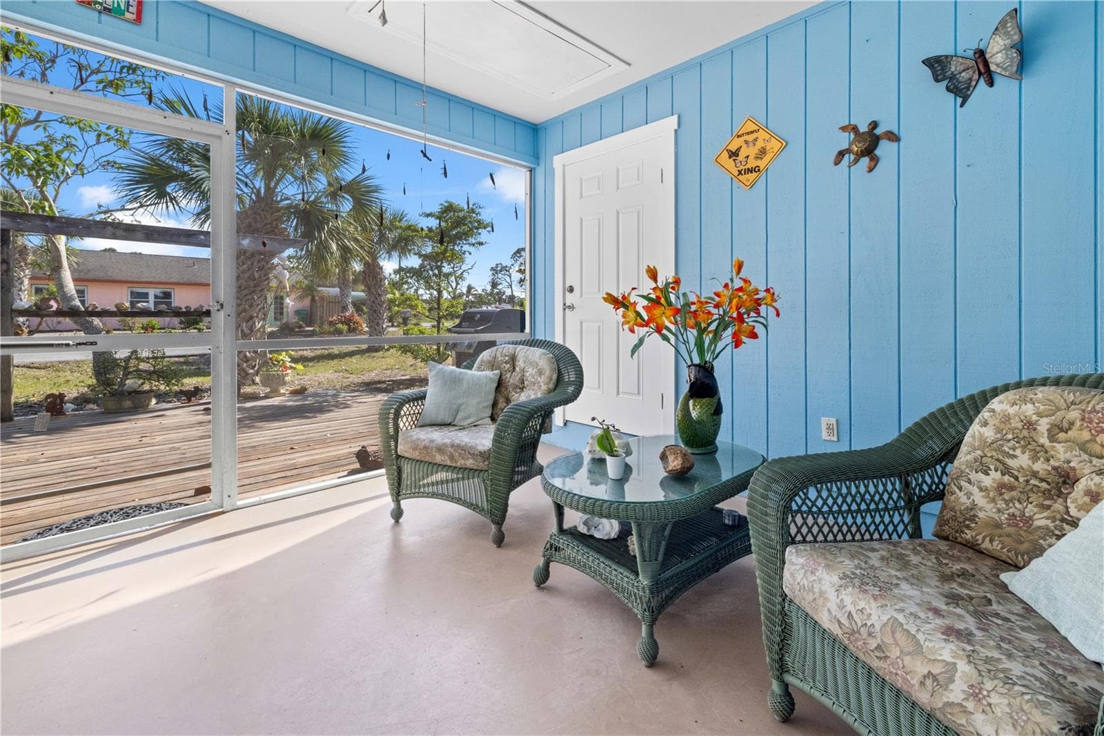 There are two ways to get to the outside lanai - from the third bedroom/family room or from the kitchen/dining room.  It's screened. - 7035 DUKE ST, ENGLEWOOD