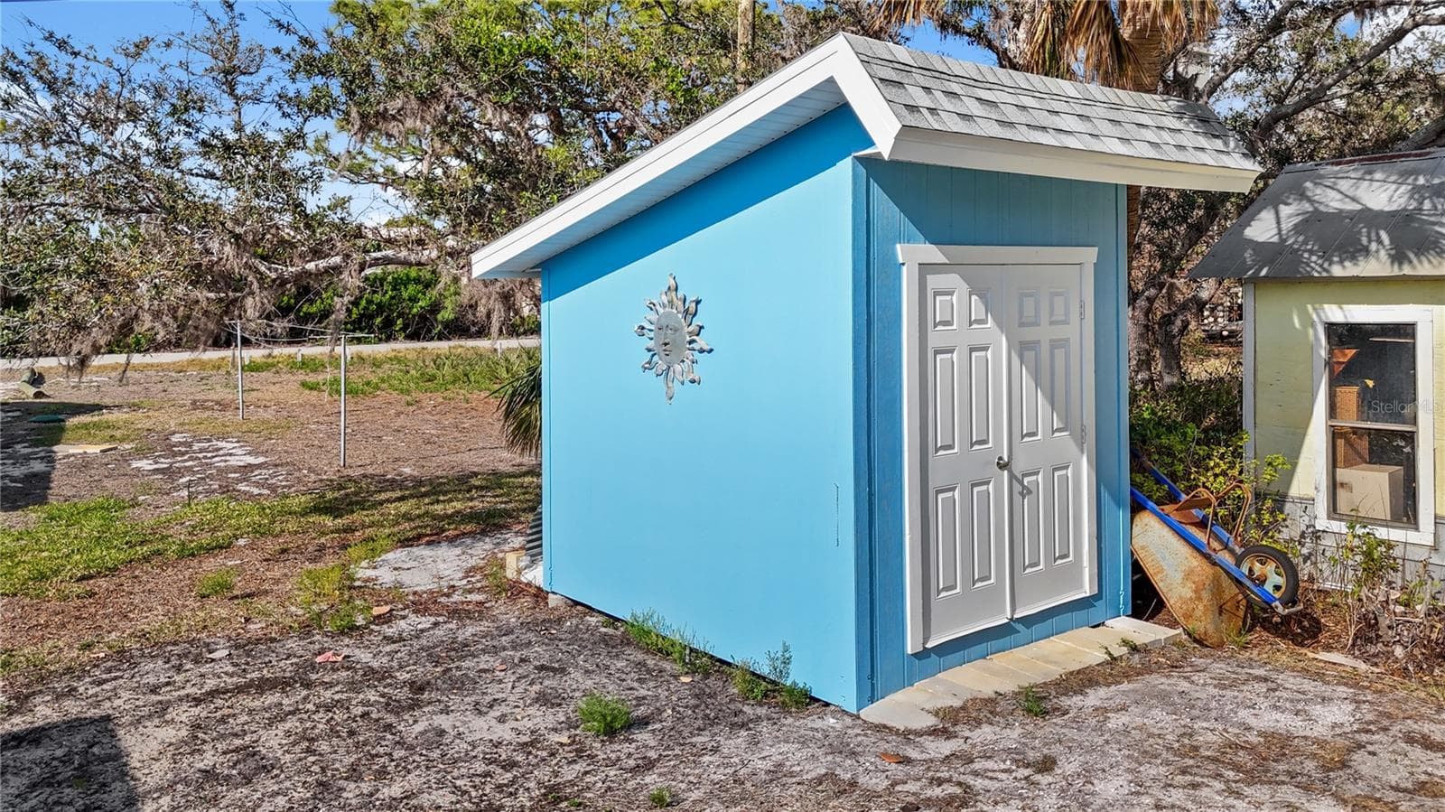 The backyard hosts it's very own storage shed.  Great for tools and garden equipment! - 7035 DUKE ST, ENGLEWOOD