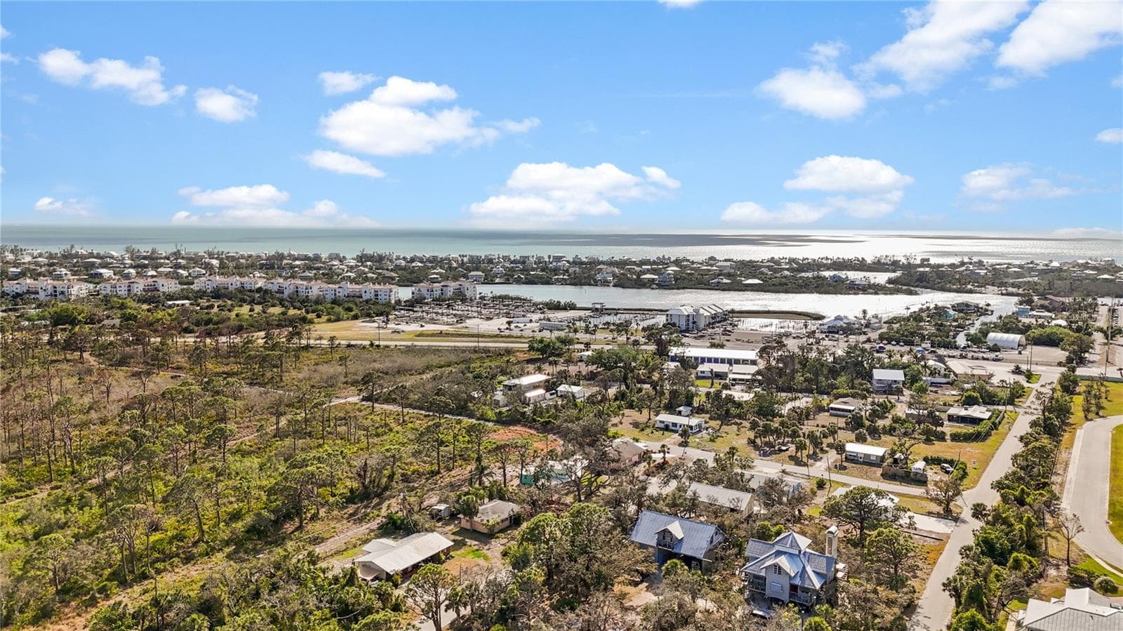 This is an aerial shot to give you and idea of where this home is situated in relation to the Gulf and marinas. - 7035 DUKE ST, ENGLEWOOD