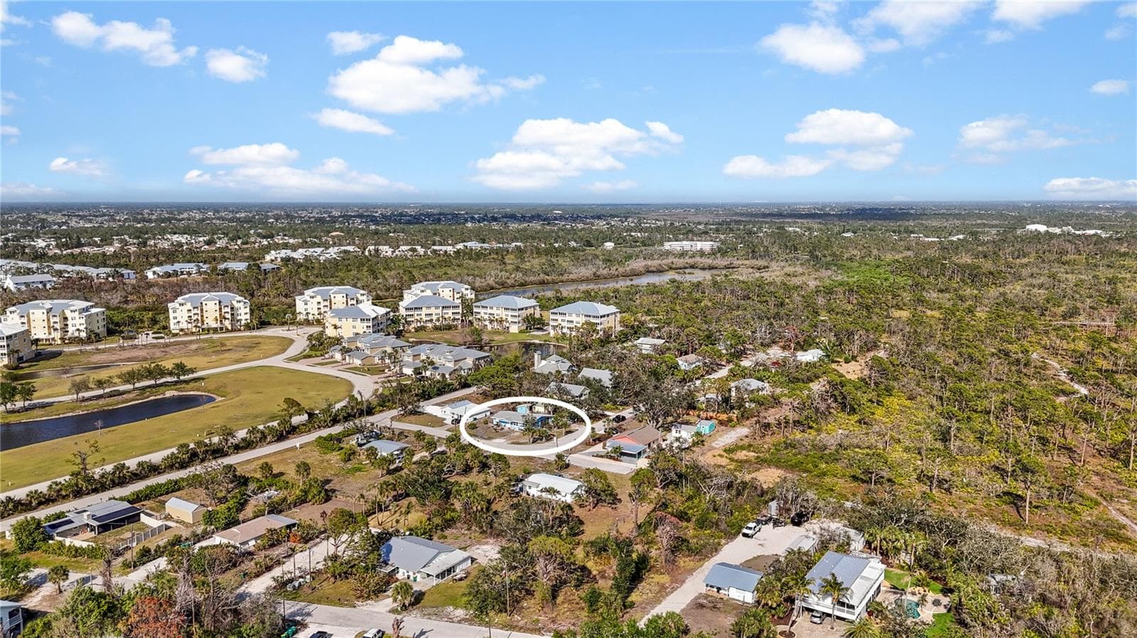 The large buildings to the north are The Hammocks, and the forested area to the south is portion of the 225 acre Amberjack Environmental Preserve.  At the end of the road is a gate where you can enter the Preserve to hike the trails. - 7035 DUKE ST, ENGLEWOOD