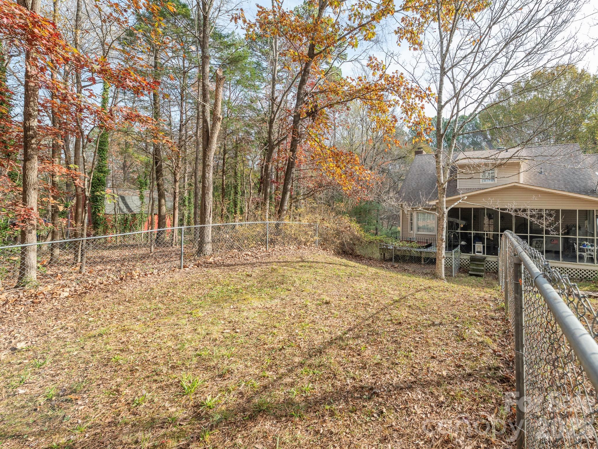 BACK YARD PARTIAL FENCED IN. TREX DECK WITH HOT TUB BESIDE SCREENED IN PORCH - 1800 Lake Lynn Road, Concord