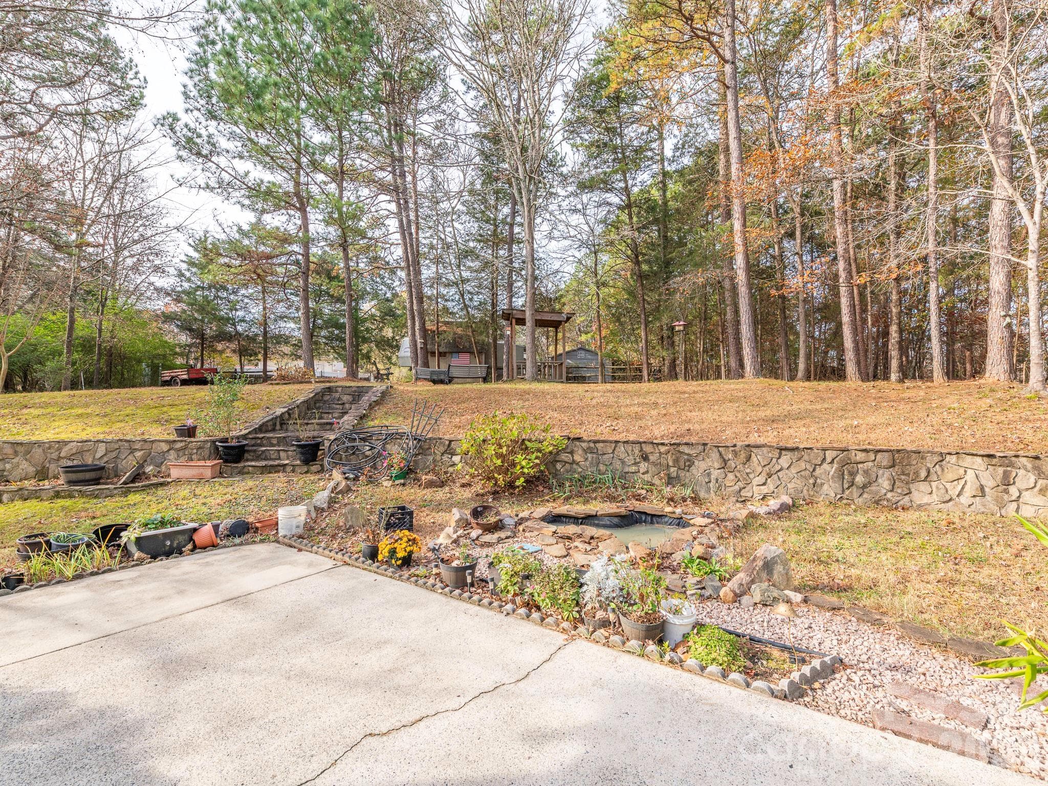 LARGE CONCRETE BACK PATIO. STONE RETAINING WALL/STEPS - 1800 Lake Lynn Road, Concord