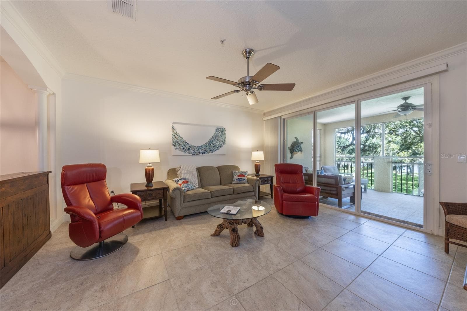 TITLED LIVING AREA WITH SLIDERS THAT OPEN TO SCREENED PATIO - 115 RIVERVIEW BND S #2123, PALM COAST