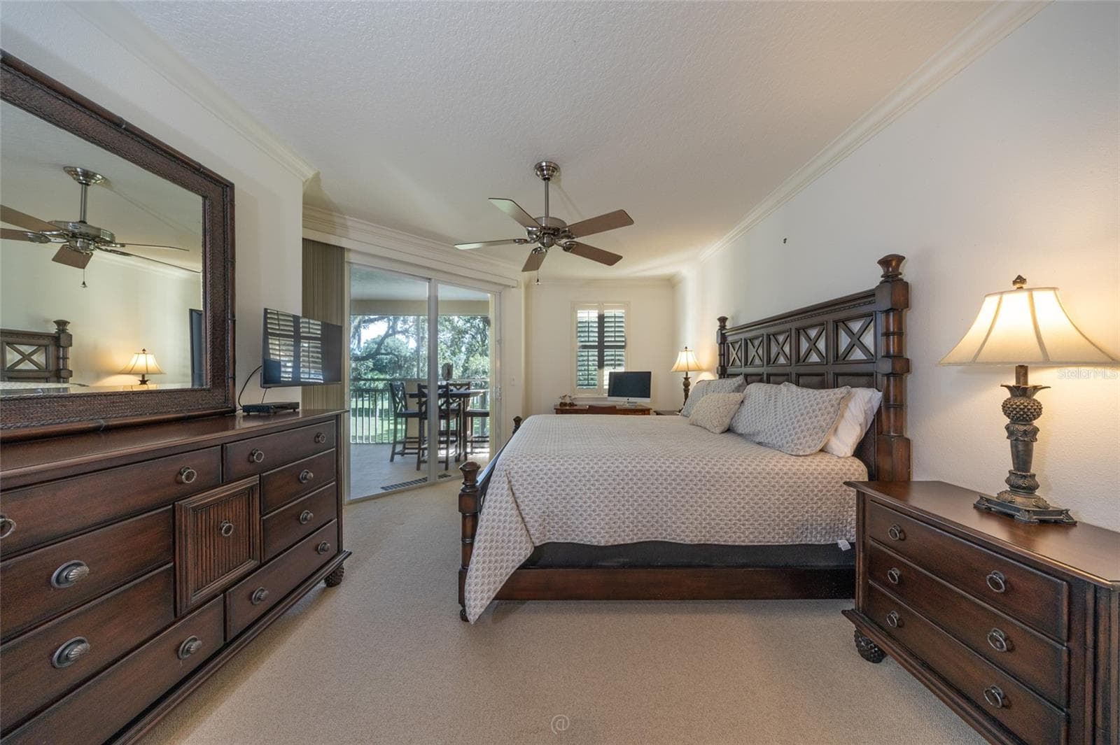PRIMARY BEDROOM WITH A VIEW AND SLIDER OPENS TO THE PATIO - 115 RIVERVIEW BND S #2123, PALM COAST
