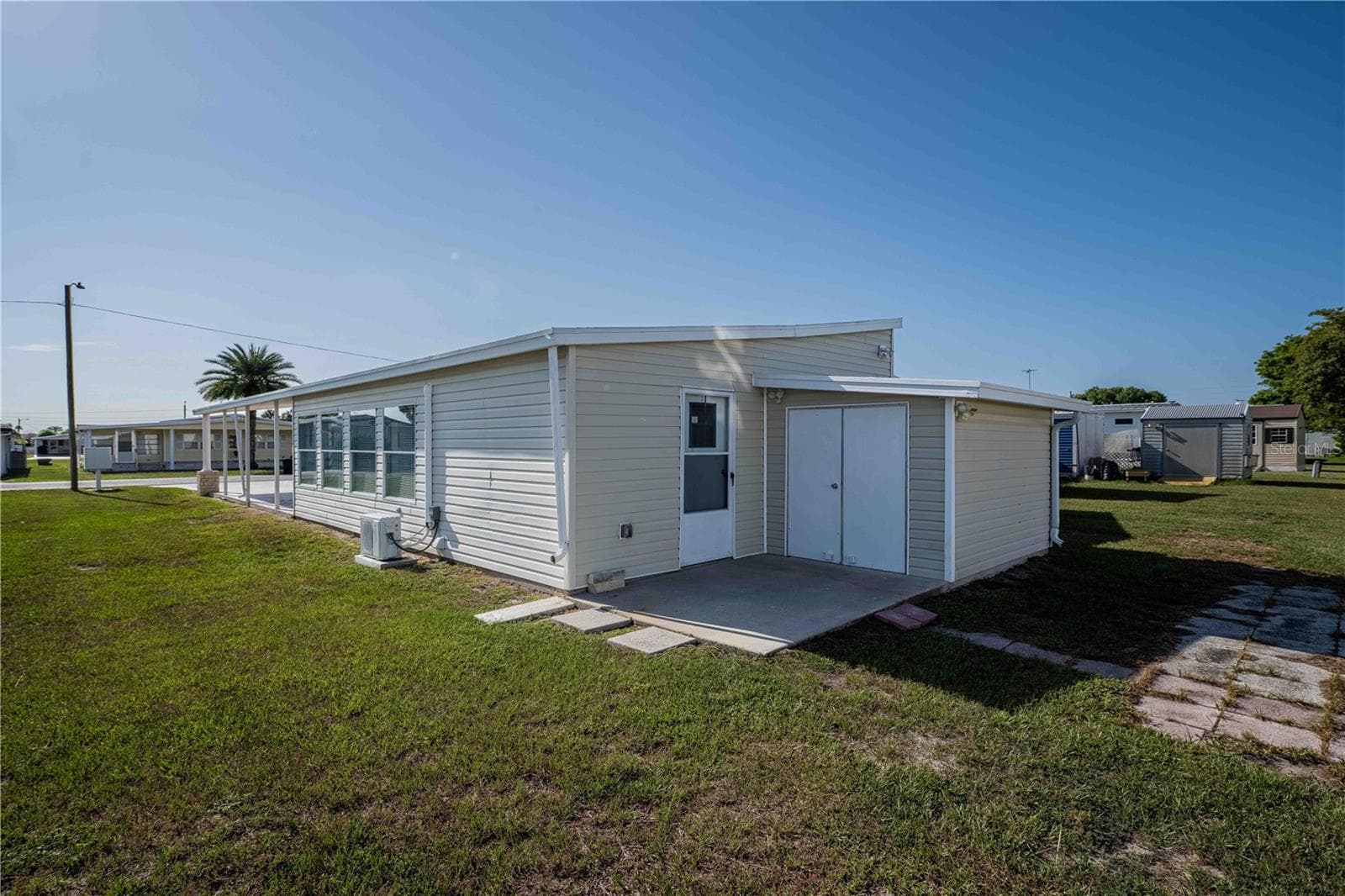 ATTACHED GOLF CART GARAGE - 5335 POWHATTAN ST, ZEPHYRHILLS