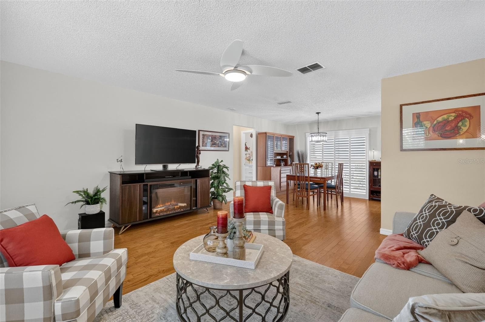 Living room open to the Dining room - 1503 ESCANDON PL, THE VILLAGES