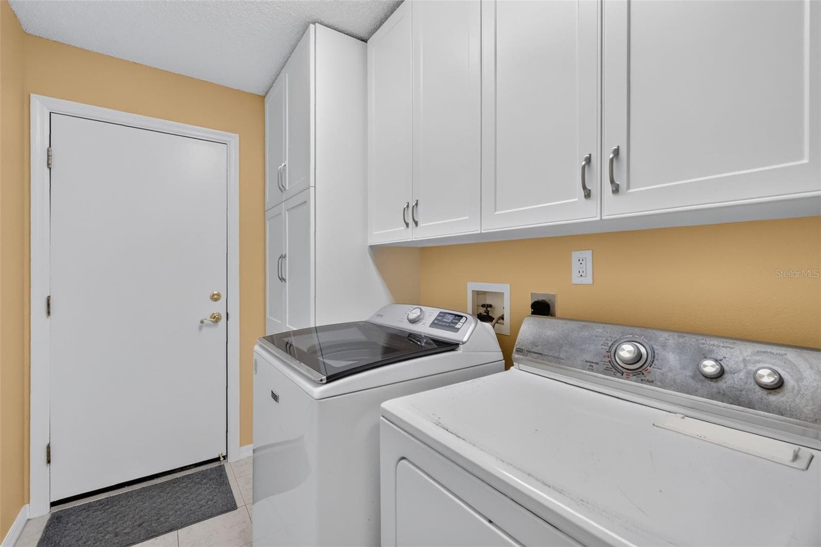 Laundry room with Custom Cabinets - Plenty of Storage - 1503 ESCANDON PL, THE VILLAGES