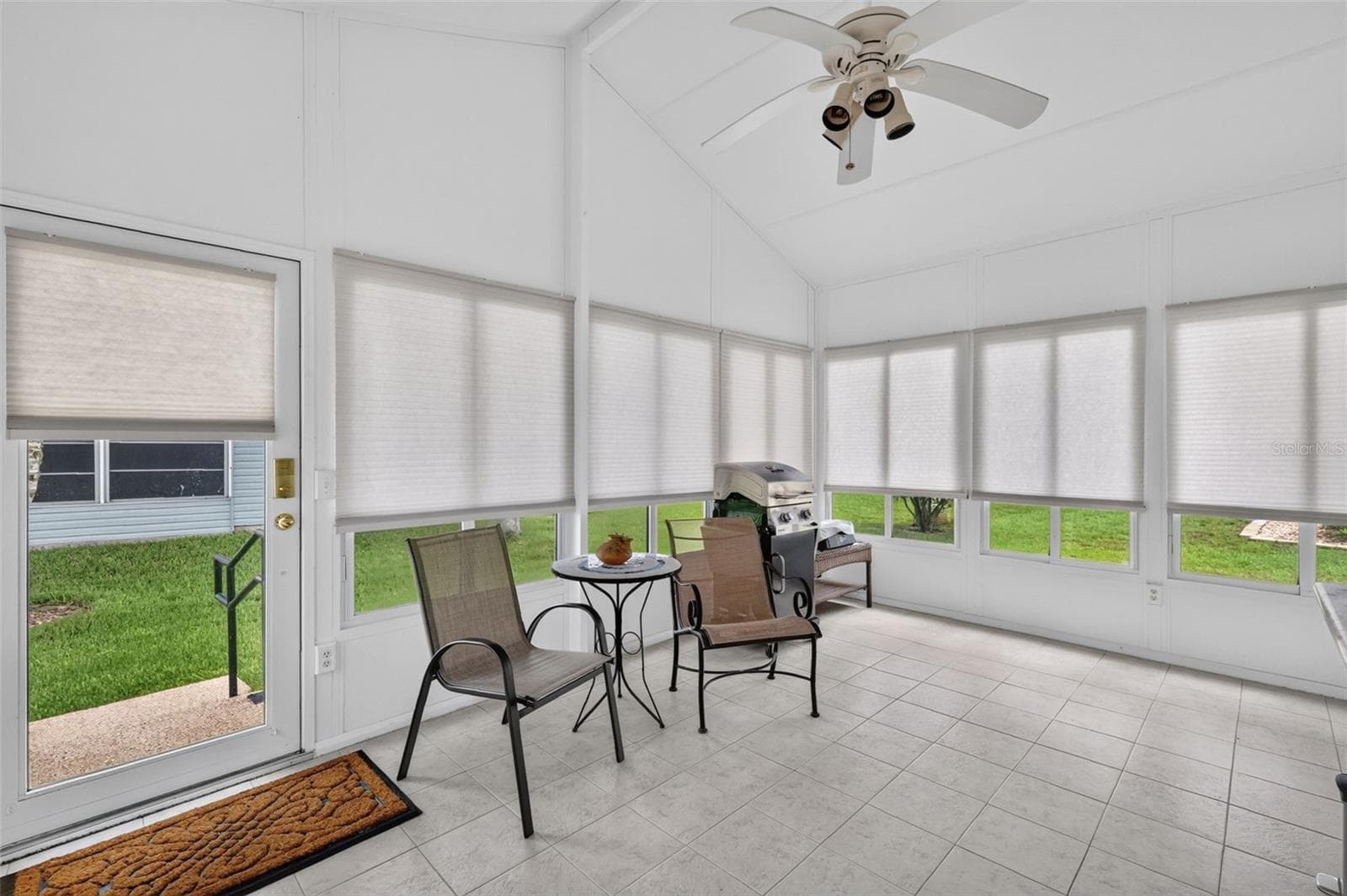 Glass Enclosed Lanai w/ceiling fan and shades - 1503 ESCANDON PL, THE VILLAGES