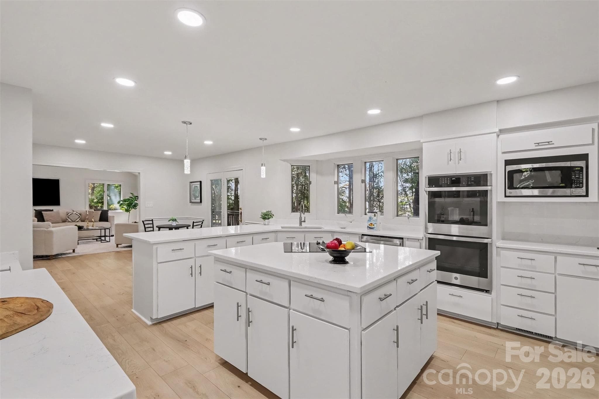 Let's talk about this new kitchen -- HUGE island, new quartz countertops and new appliances, including a double-wall oven. - 5042 Marci Lane, Belmont