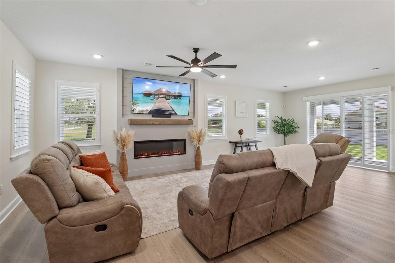 The generous living area is complete with feature fireplace. - 2985 WATER CLOVER CT, APOPKA