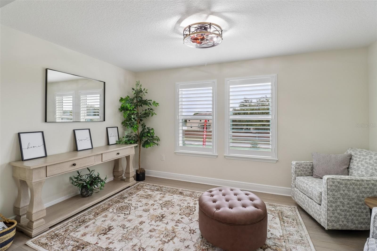 Primary suite sitting room. - 2985 WATER CLOVER CT, APOPKA