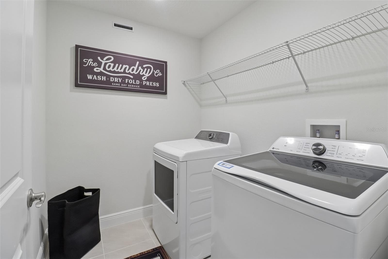 Convenient second floor laundry room. - 2985 WATER CLOVER CT, APOPKA