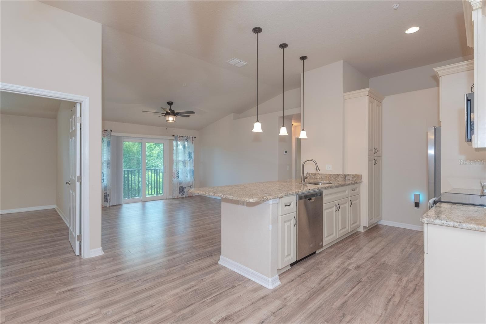 Open floor plan with cathedral ceilings. - 5065 ROYAL PALMS WAY #303, NEW PORT RICHEY