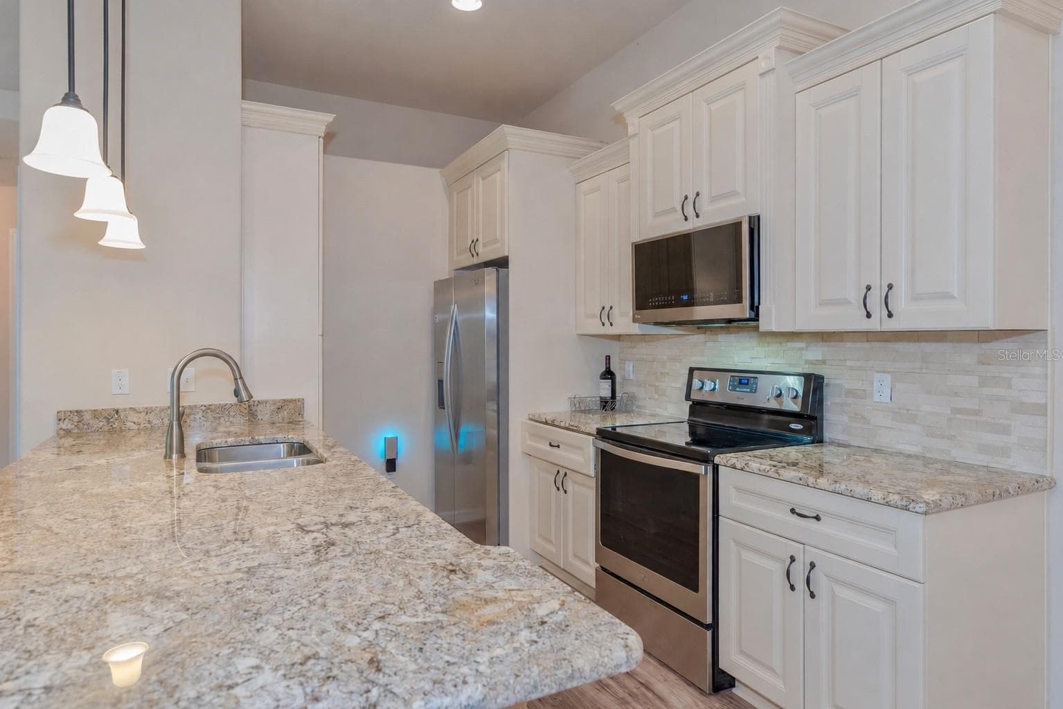 Kitchen with granite countertops. - 5065 ROYAL PALMS WAY #303, NEW PORT RICHEY