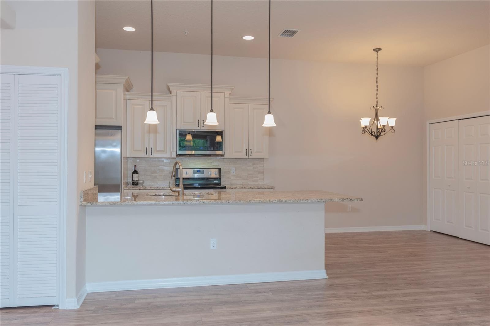 Breakfast bar between the kitchen and living room. - 5065 ROYAL PALMS WAY #303, NEW PORT RICHEY