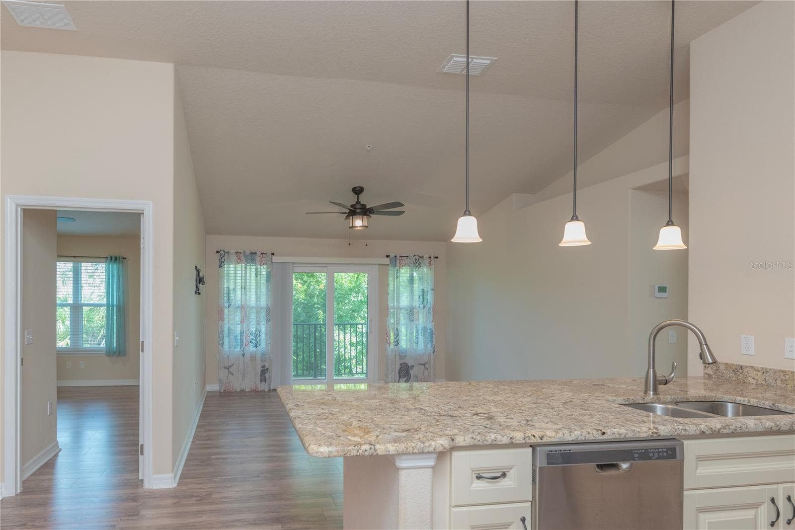 Kitchen and living room. - 5065 ROYAL PALMS WAY #303, NEW PORT RICHEY
