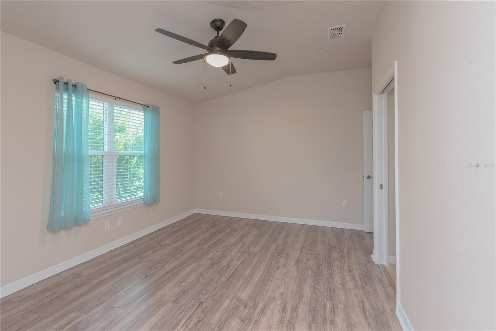Primary bedroom has walk-in closet. - 5065 ROYAL PALMS WAY #303, NEW PORT RICHEY