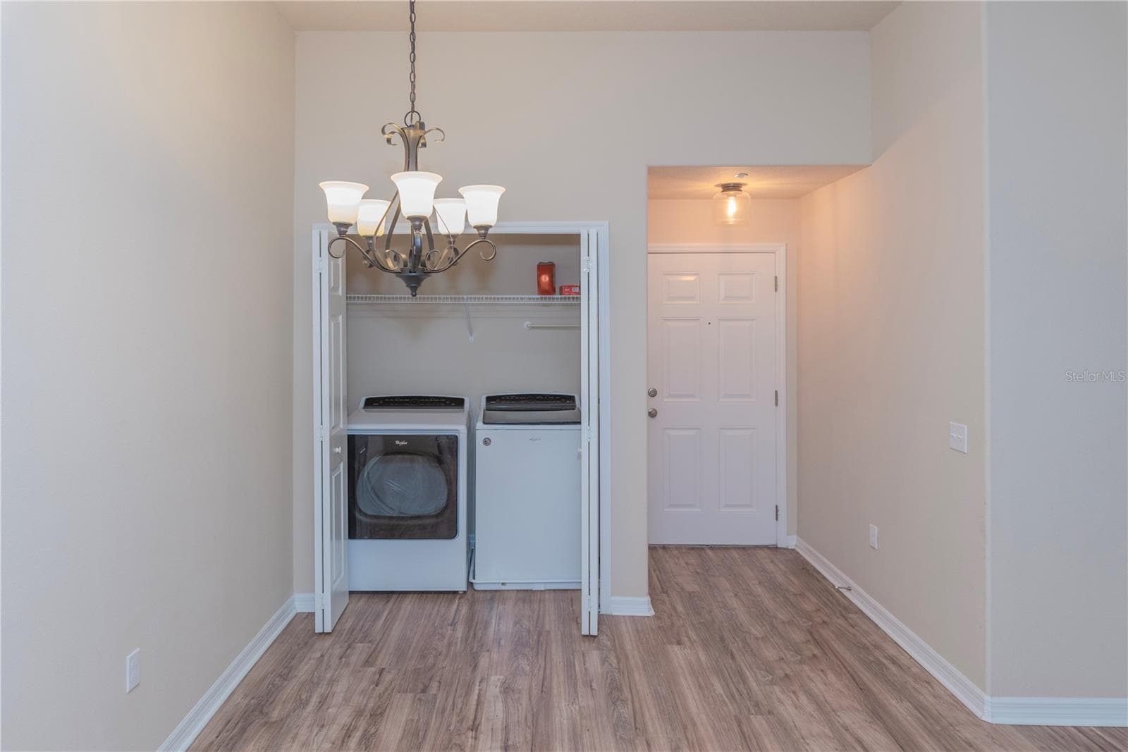 Laundry closet and dining room. - 5065 ROYAL PALMS WAY #303, NEW PORT RICHEY