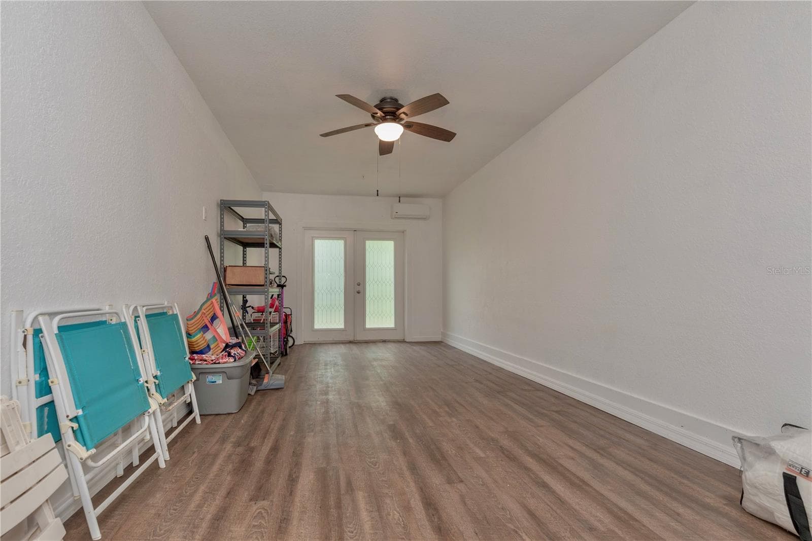 Downstairs storage room is air conditioned with a mini split. - 5065 ROYAL PALMS WAY #303, NEW PORT RICHEY