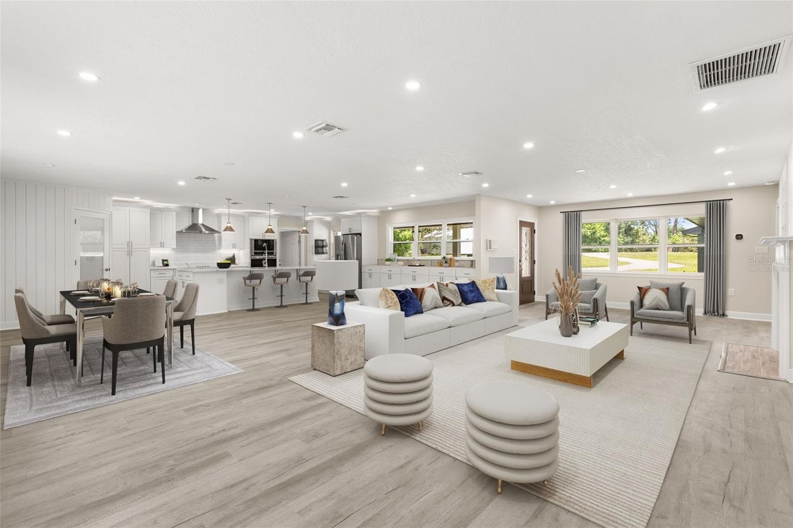 Great Room virtually staged: Entry, Living Room, Dining Room, Kitchen - 1602 COUNTRY CLUB RD, EUSTIS