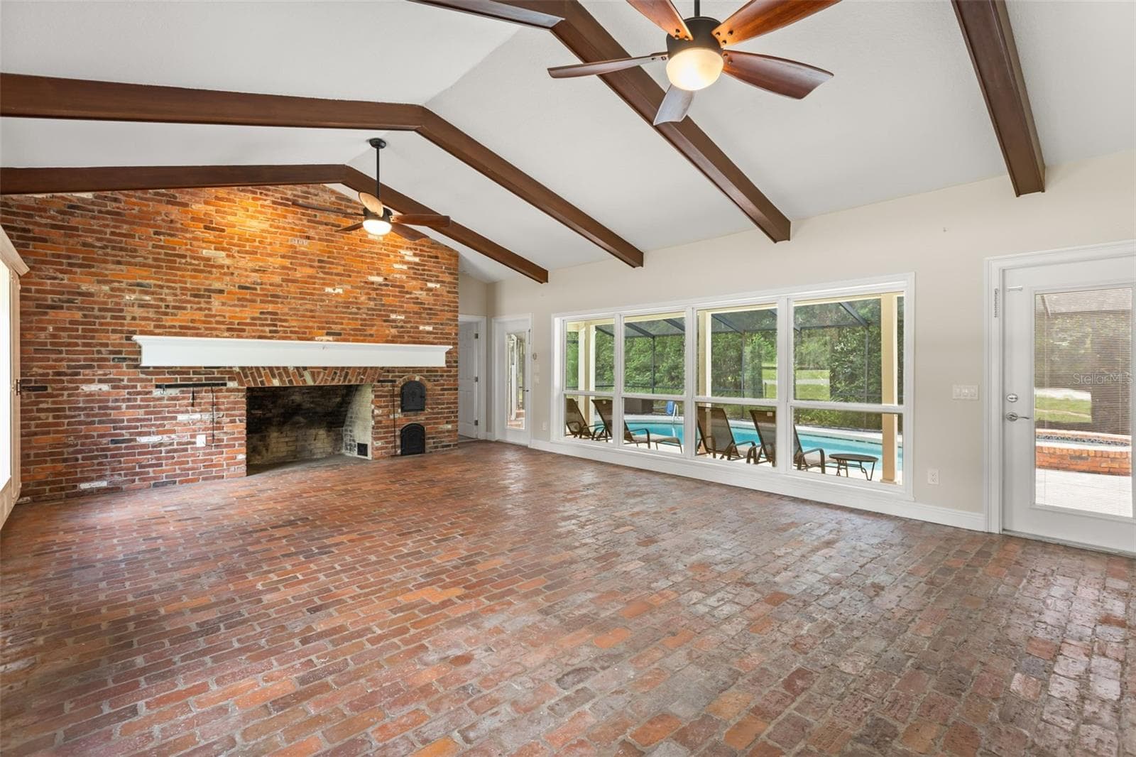 Family Room with view of Lanai and Pool - 1602 COUNTRY CLUB RD, EUSTIS