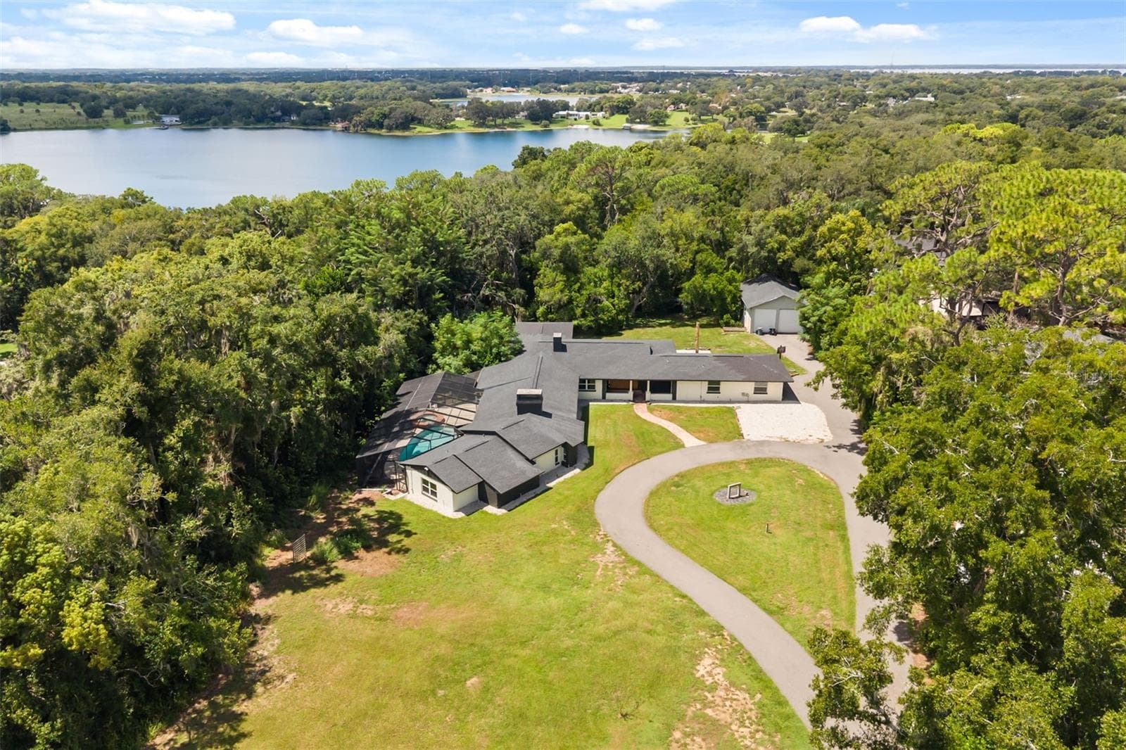 Aerial of property with East Crooked Lake in view - 1602 COUNTRY CLUB RD, EUSTIS