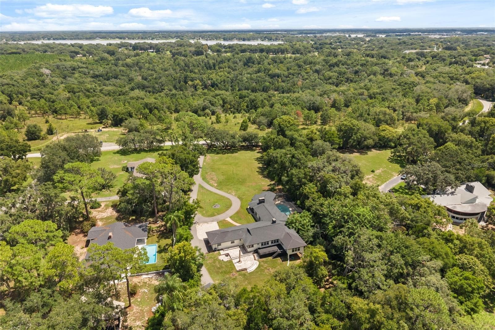 Aerial of property with Lake Joanna in viw - 1602 COUNTRY CLUB RD, EUSTIS